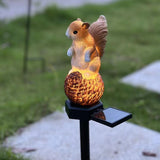 Squirrel stepping pine nut solar garden light